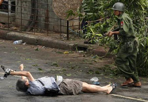 Kenji Nagai shot by the Burma military, with his camera still on his hands. Photo identified to be copyrighted by Reuters BBC News source
